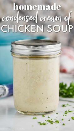 homemade chicken soup in a mason jar with parsley on the side