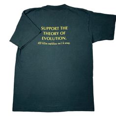 a green t - shirt with the words support the theory of evolution written on it