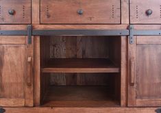 a wooden cabinet with metal handles and drawers