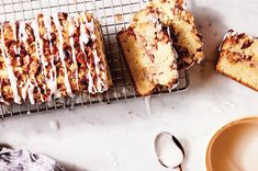 a bunch of food that is sitting on a rack next to a cup and saucer