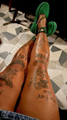 a person with tattoos on their legs and feet