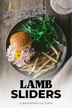 lamb sliders with arugula and greens on a plate