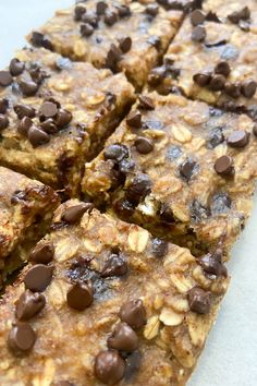 chocolate chip granola bars cut into squares and stacked on top of each other