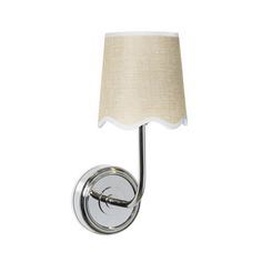 a wall light with a white shade on the side and a silver metal frame around it