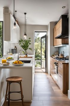 a kitchen with an island and stools next to the counter top in front of it