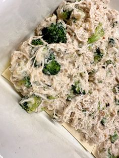 a white plate topped with pasta and broccoli