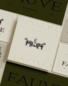 four business cards with animals on them and the words fauvve studio written in black ink