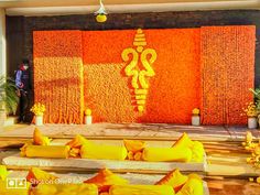 the stage is decorated with yellow and orange decorations