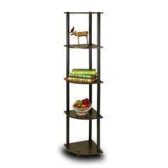 three tiered shelving unit with bookshelf and bowl of fruit on top