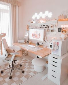 a room with a desk, chair and computer on top of the desk is decorated in pastel colors