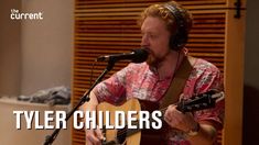 a man with headphones on playing an acoustic guitar in front of a microphone and the words tyler children