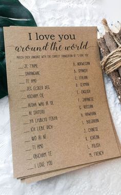 i love you around the world card with twine on it next to a plant