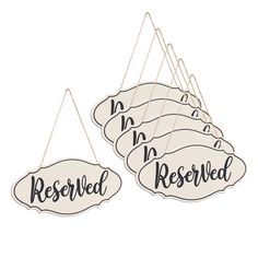 three hanging signs that say reserved and reserved