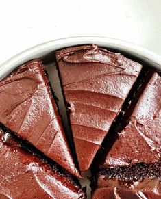 a chocolate cake cut into slices in a pan