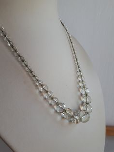 Gorgeous and extremely brilliant ART DECO finely hand faceted rock crystal beaded graduated necklace with the beads strung on silver chain (I didn't test it but it is probably a sterling chain) - with clasp.  The beads on the front (along 5.5 inches) are ball shape and they change to bicone shape on each side. Length: 19 inches; the beads graduate from 12 to 5 mm. Good condition with no chips or cracks; the chain is visible on each end on the necklace near the clasp - sold as is.  A fantastic '' something old'' for a bride IMPORTANT TO READ: To make this a smooth and pleasant transaction experience for everyone, all buyers need to read and understand the description, the terms of sale , the payment and the shipping indicated in this listing. TERMS OF SALE A. SHIPPING WORLDWIDE This listing Elegant Faceted Round Bead Crystal Necklaces, Elegant Faceted Rondelle Crystal Necklace, Silver Faceted Rondelle Beaded Necklaces, Silver Faceted Briolette Crystal Necklace, Formal Single Strand Crystal Necklace With Round Beads, Elegant Beaded Necklaces With Faceted Beads For Anniversary, Elegant Clear Jewelry With Polished Beads, Vintage Clear Necklace For Wedding, Silver Faceted Rondelle Crystal Necklaces