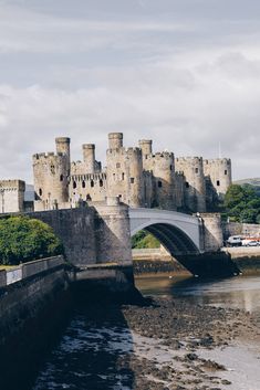 an old castle with a bridge over the water