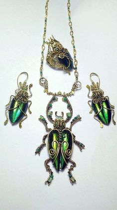 Beetle Pendant wire wrap scarab jewelry Insect jewelry. | Etsy Gold Bohemian Malachite Jewelry, Gold Bohemian Jewelry With Malachite, Green Metal Cabochon Jewelry, Green Cabochon Metal Jewelry, Antique Brass Wire Wrapped Jewelry, Antique Wire Wrapped Brass Jewelry, Unique Hand Forged Green Jewelry, Handmade Art Nouveau Brass Jewelry, Green Metal Collectible Jewelry