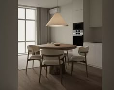 a dining table with four chairs around it in the middle of a living room and kitchen area