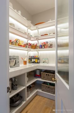 a kitchen pantry with lots of food in it