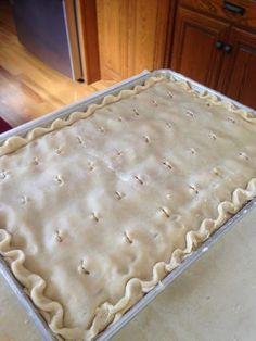 an uncooked pie sitting on top of a counter