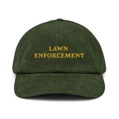 "Lawn Enforcement" Embroidered Corduroy Hat 🌿🚜 Calling all garden lovers and lawn care enthusiasts--our "Lawn Enforcement" embroidered corduroy hat is here to keep your backyard in check! Whether you're the king of the mower or just proud of your perfectly manicured lawn, this hat is a funny and stylish way to show off your dedication to lawn maintenance. Perfect for gardeners, dads who love a good dad joke, and anyone who takes lawn care seriously (but not too seriously!). Key Features: 🌿 10 Manicured Lawn, Trimming Hedges, Funny Dad Jokes, Embroidered Corduroy, Corduroy Hat, Gardening Hat, Cool Uncle, Garden Lover Gifts, Dad Jokes Funny