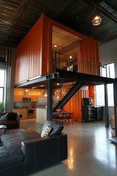 a living room filled with furniture and lots of shipping containers on the wall behind it