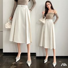 Elegant High-Waisted Midi Skirt High Waist Pleated Skirt For Spring, White Pleated Skirt For Winter, White Flared Skirt For Winter, High Waist Solid Skirt For Spring, White Lined Skirt For Winter, White Knee-length Skirt For Fall, White High Waist Skirt For Fall, White Midi Skirt For Winter, Chic White Pleated Skirt For Fall