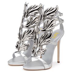 Elevate your evening look with these metallic silver strappy-heeled sandals. Featuring an open-toe and adjustable buckle strap design, these shoes add a touch of glamour and sophistication to any outfit. Color: Silver Material: Metallic finish Heel type: Stiletto Heel Heel height: 4.72" / 120 mm approx Product measurements were taken using size 8. Please note that measurements may vary by size. Toe: Open toe Adjustable buckle strap design Handcrafted US sizing. Fits true to size. Silver Open Toe Party Heels, Metallic Silver Heels With Ankle And Heel Straps, Luxury Silver Heels With Buckle Closure, Silver Heels With Buckle Closure, Silver Heels For Summer Gala, Silver High Heels With Heel Strap, Summer Silver Heels With Buckle Closure, Silver Heels With Buckle Closure For Summer, Silver Open Toe Heels With Buckle Closure