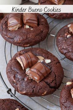 chocolate cookies with peanut butter on top are cooling on a wire rack