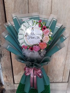 a bouquet of flowers in front of a wooden wall