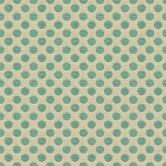 a green and white polka dot pattern on fabric