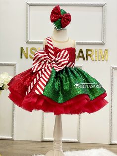 Introducing Our Enchanting Christmas Holiday Dress for Girls The magic of the holiday season comes to life with our exquisite knee-length, flared Christmas holiday dress specially designed for your little princess. Make this festive season unforgettable with this delightful creation. This Christmas holiday dress is a vision of yuletide joy, featuring a rich red and green sequined fabric. The vibrant colors, paired with its sleeveless design, ensure your child will look and feel like the belle of Green Christmas Princess Dress For Dress-up, Red Princess Dress For Christmas Dress-up, Christmas Party Sleeveless Princess Dress, Sleeveless Christmas Princess Dress For Holiday, Sleeveless Christmas Holiday Princess Dress, Sleeveless Christmas Princess Dress, Sleeveless Princess Dress For Christmas Holiday, Red Princess Dress For Party Season Festivities, Sleeveless Princess Dress For Christmas