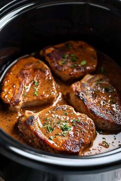 three pieces of meat in a slow cooker