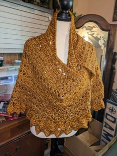 This beautiful handmade crochet shawl/wrap is a must-have accessory for any fashion-forward woman. The stunning gold color adds a touch of elegance to any outfit, making it perfect for both casual and formal occasions. Crafted with care and attention to detail, this shawl/wrap is made to last and will surely become a cherished addition to your wardrobe. Whether you're looking to elevate your outfit or simply want to stay stylish and comfortable, this handmade crochet shawl/wrap is the perfect ch Elegant Gold Scarf One Size, Gold Shawl For Fall, Bohemian Gold Shawl Scarves, Crochet Shawl Wrap, Gold Scarf, Crochet Shawls And Wraps, Outfit Making, Shawl Wrap, Crochet Shawl