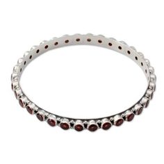 Garnet gem of love and passion shares its crimson energy in the cheerful design of this bangle from India. From Bhavesh the sterling silver bracelet is crafted with a high polished finish and 15 gemstone carats. .925 Sterling silver Garnet Gem, Love Energy, Silver Bangle Bracelets, Jewelry Online Shopping, Sterling Silver Bracelet, Silver Bangles, Bangle Bracelet, Sterling Silver Bracelets, Mens Bracelet