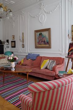 a living room filled with furniture and decor