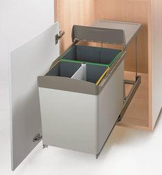 an open cabinet with two bins on the bottom and one drawer in the middle