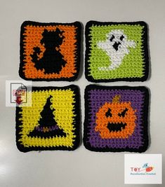 four crocheted halloween coasters on a table