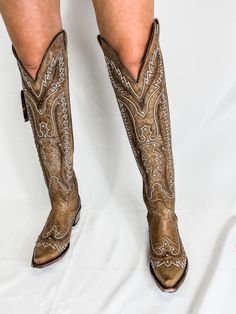 These cowboy boots are a must have in your closet. They are a literal staple piece. These knee high boots feature rhinestones throughout the boot. They are genuine leather handmade in Mexico. We recommend ordering your normal boot size as these do run true to size. Our model is 5'4 wearing a 9, her normal shoe size. Over The Knee Western Boots, Long Cowboy Boots, Knee High Cowgirl Boots, Nfr Outfits, Must Have In Your Closet, Knee High Cowboy Boots, Custom Cowboy Boots, Country Outfit