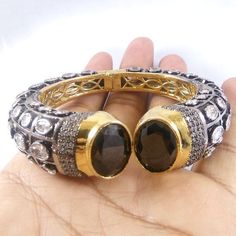 This Listing is for 1 Piece Beautiful Black Onyx & CZ Hydro Gemstone 24k Gold Plated Cuff Bangle Bracelet Jewelry Gemstone: Black Onyx & CZ Metal : Brass Style : Cuff Bracelet Size : Cuff Adjustable Size Plating : 24k Gold Plated & Black Oxidize Color : Yellow,White, Black Note : We Ship Parcel Via India Post Economy Shipping It's Take 20 To 25 Days To Arrive. Check my other items frequently. I will be adding to the inventory regularly. Be sure to visit my shop to check for any coupo Luxury Black Oxidized Finish Bracelet, Luxury Black Oxidized Bracelet, Luxury Black Bangle, Bangle Bracelet Gold, Natural Gemstone Necklace, Bollywood Jewelry, Cuff Bangle Bracelet, Bezel Pendant, Silver Jewelry Pendant