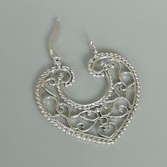 Indian style sterling silver filigree ear hoops. Dimensions: 31.5 x 33 mm weight: 5.8gm Price listed is for ONE PAIR These are made of 925 hypoallergenic sterling silver. Most of my pieces come with a 925 stamp. Can be packaged in a gift box. I can include a personal message from you if needed You are welcome to contact me at... bhavnakwintra1956@gmail.com For more beautiful pieces from my shop, please browse 👇 TOE RINGS: https://www.etsy.com/your/shops/TheSilverGame/tools/listings/section:2702 Small Hoop Sterling Silver Filigree Earrings, Small Sterling Silver Filigree Hoop Earrings, Silver Bohemian Heart Earrings, Bohemian Silver Heart-shaped Earrings, Bohemian Silver Heart Earrings, Nickel Free Elegant Hoop Heart Earrings, Ornate Silver Hoop Earrings With Intricate Design, Bohemian Sterling Silver Heart Earrings, Nickel-free Elegant Hoop Heart Earrings