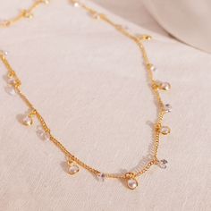 "Elevate your elegance with our Pearl Cubic Necklace, a truly fancy and shiny accessory that's perfect for any party. Let your style shine with this exquisite piece of jewelry. Personalized Y Necklace https://www.etsy.com/listing/1523378005/personalized-y-necklace-16k-gold-plated double chain simple initial necklaces https://www.etsy.com/listing/1521967169/double-chain-simple-initial-necklaces # SPECIFICATION Material: 16K Plated Jewelry Color: Gold ball size: 3.3mm ball Chain length: 17.5\" Ple Elegant Metal Necklace As A Gift For Her, Costume Jewelry Clavicle Chain For Party, Party Costume Jewelry With Clavicle Chain, Party Costume Jewelry Clavicle Chain, Adjustable Sparkling Gold Necklace, Elegant Adjustable Crystal Necklace, Gold Plated Jewelry For Party, Party Jewelry With Adjustable Chain In Cubic Zirconia, Dazzling Delicate Chain Necklace For Wedding