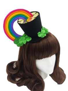 a wig with a hat on top of it and rainbows in the back ground