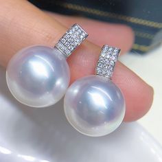 Stunning South Sea White Pearl Earring, 13mm, Beautiful Bright Cool White Color, Very High Luster. Absolutely Eye-Catching beauty. Solid 18k White Gold  with sparkling cubic zircons, Very Well made and Comfortable to wear. So Simple, So Elegant! Unmistakable South Sea pearls.  Elegant and Stunning   Lustrous Beauty  🤩 Pearl ★ Pearl: Genuine South Sea White Pearls, Saltwater ★ Origin: Australia  ★ Size: 13mm ★ Shape: Near Round ★ Color: Natural untreated, Beautiful Bright Cool White Color with l Dazzling White Round Diamond Earrings, Dazzling White Pave Setting Earrings, White High Luster Earrings For Anniversary, Luxury White Pearl Earrings With Pave Setting, Fine Jewelry Pearl Earrings With Pave Setting For Anniversary, Fine Jewelry White Gold Pearl Earrings With Pave Setting, Diamond White Pearl Earrings With Pave Setting, Anniversary Pearl Earrings With Pave Setting, White Pave Set Earrings For Wedding