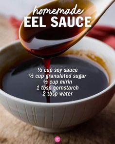 the ingredients for homemade el sauce in a white bowl with a spoon full of liquid