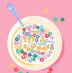 a cereal bowl with the word happy spelled in it and sprinkles scattered around