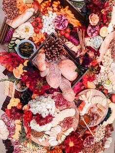 an assortment of meats and vegetables arranged on a platter for a thanksgiving feast