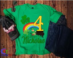 A Personalized St Patricks Day Birthday Shirt? What a fun cool shirt for a birthday gift. Let your little one enjoy this Personalized Lucky Charm Birthday shirt with his or her name and age personalized on the shirt. With our 100% preshrunk cotton shirts and our top of the line DTG printing process your shirt will last wash after wash and look good as new for a long time. Just purchase in the size you need and be sure to let us know in the checkout the name and age you need. LOOKING FOR SHIRTS F Green Custom Print T-shirt For Birthday, Customizable Green T-shirt For Birthday, Fun Green T-shirt For Birthday, Green Fun Birthday T-shirt, Green Custom Print Birthday T-shirt, Green Tops With Name Print For Birthday, Lucky Charm Birthday, 1st Birthday Boy Shirt, St Patricks Day Birthday