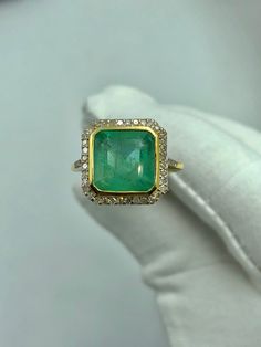 Luxury Emerald Crystal Ring For Anniversary, Luxury Yellow Gold Emerald Ring For Women, 14k Gold Gia Certified Emerald Ring Gift, Gia Certified 14k Gold Emerald Ring Gift, Gia Certified Gold Rings For May Birthstone, Emerald Cluster Ring Stamped 14k As Gift, 14k Gold Gia Certified Rings With May Birthstone, Gia Certified Gold Emerald Ring, Emerald-cut Yellow Gold Halo Ring For Gift