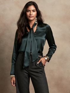 Modern and minimalist, this at-ease blouse has a removable tie-neck for even greater versatility, crafted in luxuriously soft silk charmeuse, beloved for its lustrous finish.  SEMI-FITTED: Cut for a not-too-tight, not-too-loose fit.  V-neck with removable tie-neck.  Shirttail hem.  Semi-fitted.  Long sleeves.  Hip length.  Body length (size S): Petite 26", Regular 27. 5", Tall 29. 5" Sleeve length from center back: Petite 30", Regular 32", Tall 34" Model: Size S or XL, 5'10" (178cm).  Machine wa Silk Blouse Outfit, Purple Blouse, Tie Styles, Silk Charmeuse, Womens Tie, Blouse Outfit, Colourful Outfits, Work Attire, Mom Style